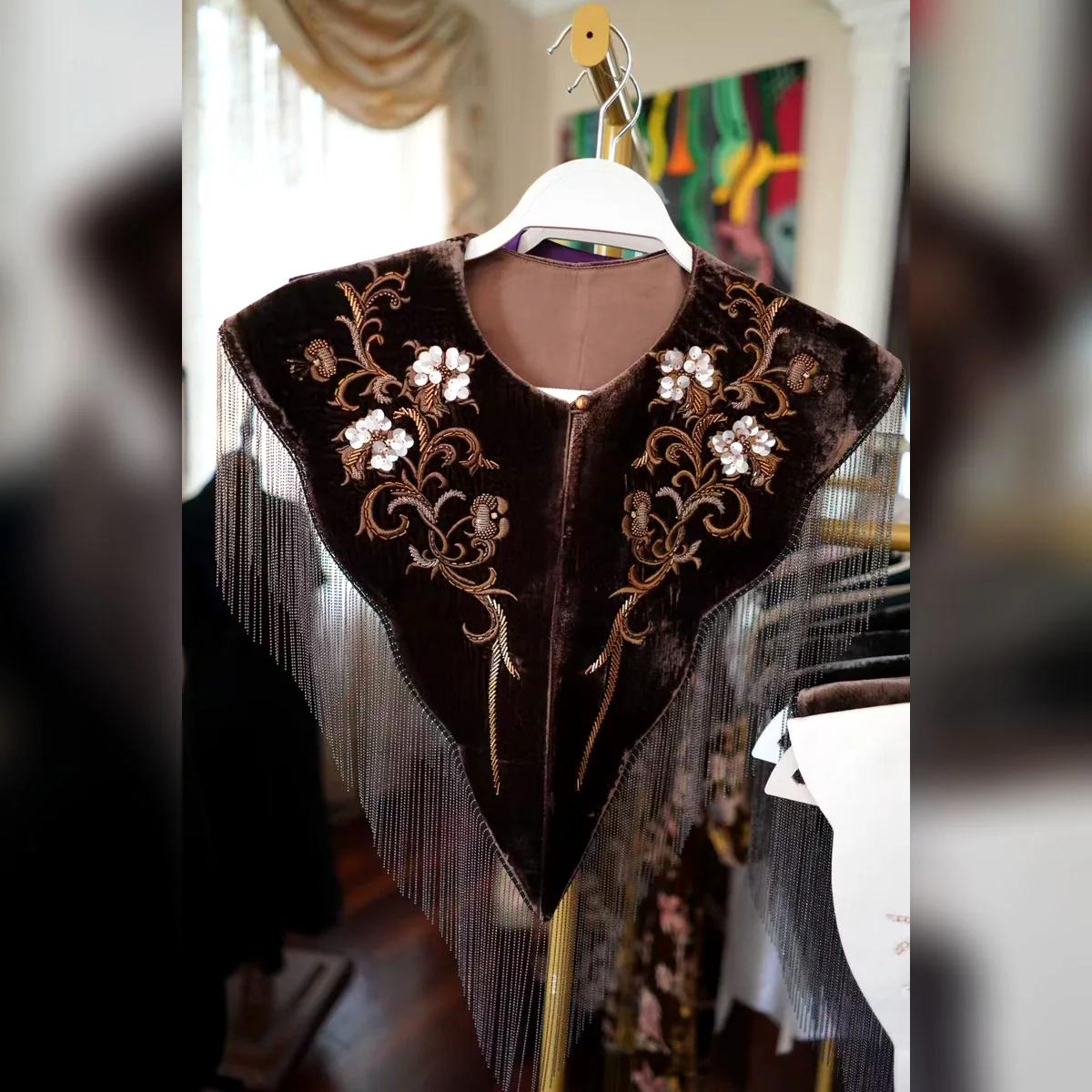 Espresso velvet beaded fringe collar displayed on a hanger